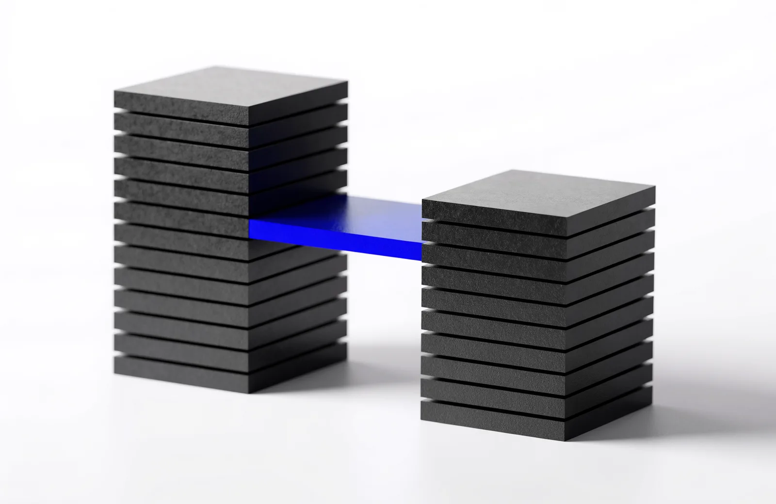Two separate black stacks standing apart, joined by a single blue slab spanning the gap.