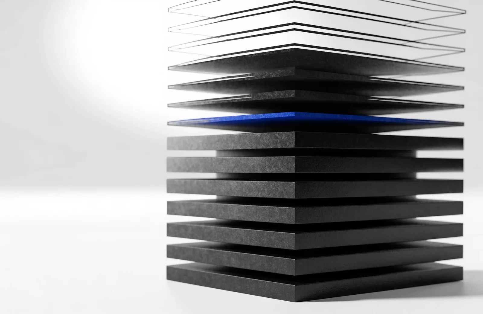 A stack of black layers, solid at the base and becoming unfilled wireframe outlines toward the top, with a blue layer at the boundary.